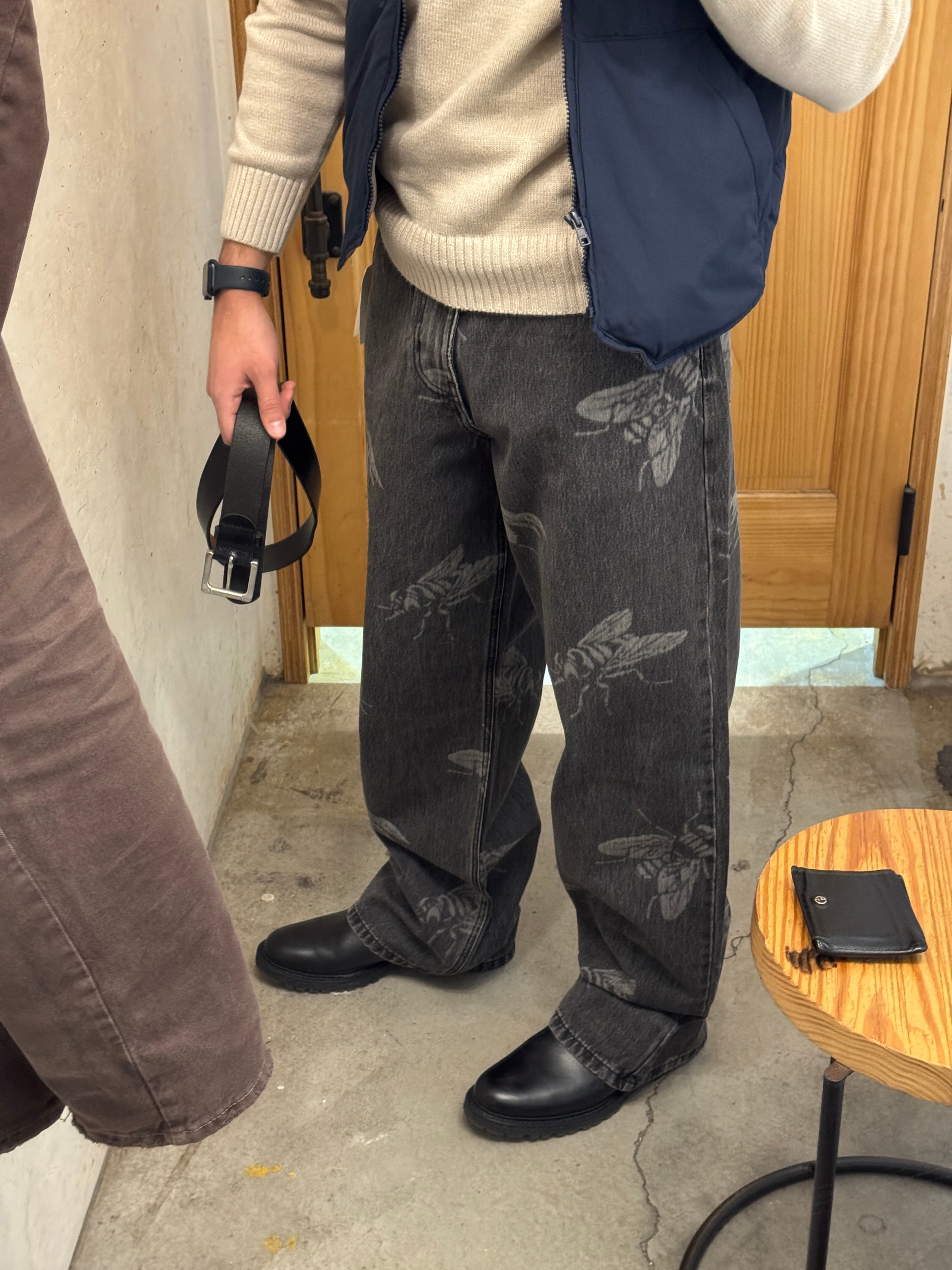 Mirror selfie with puffer vest and fly jeans